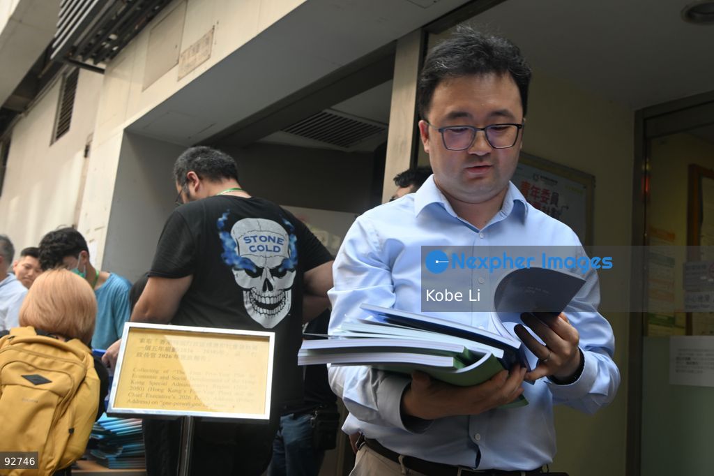 A man reading a book of the First Five-Year Plan for Economic and Social Development of the Hong Kong Special Administrative Region (2026-2030) and the Chief Executive's 2026 Policy Address on September 16, 2026 in Hong Kong. (Photo by Kobe Li/Nexpher Images)