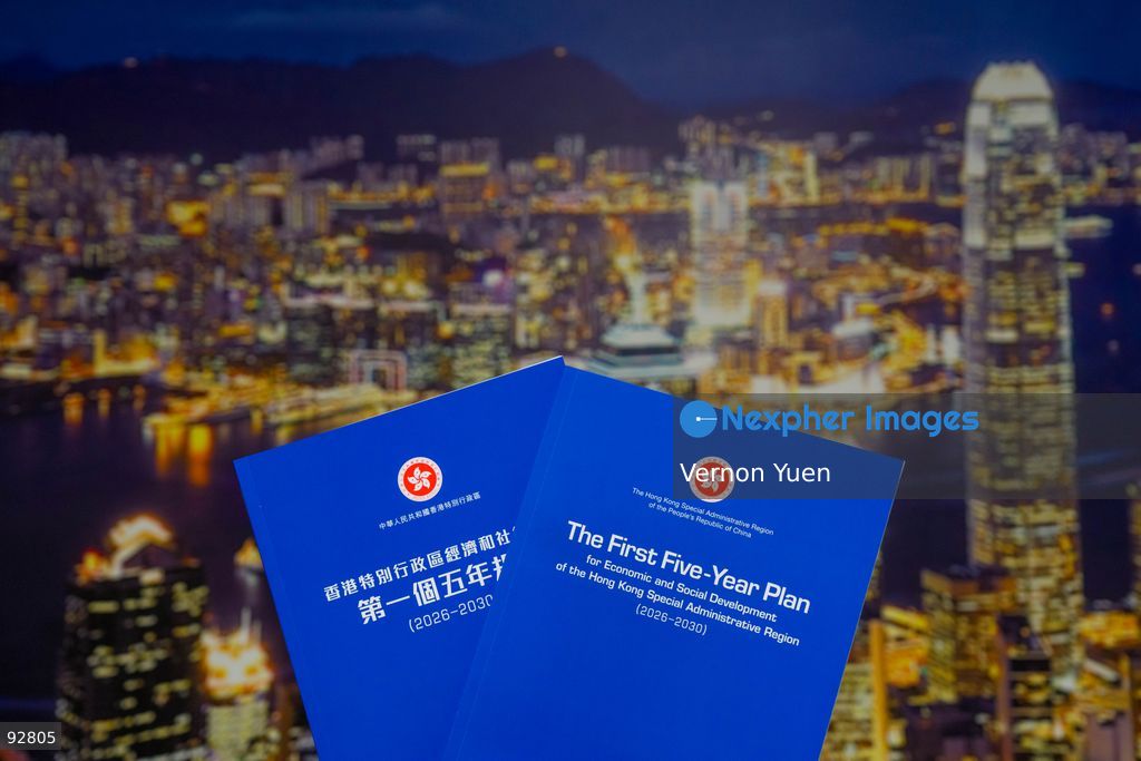 The First Five Year Plan booklet in front of a photo of the Hong Kong Skyline on September 16, 2026 in Hong Kong. (Photo by Vernon Yuen/Nexpher Images Stock)