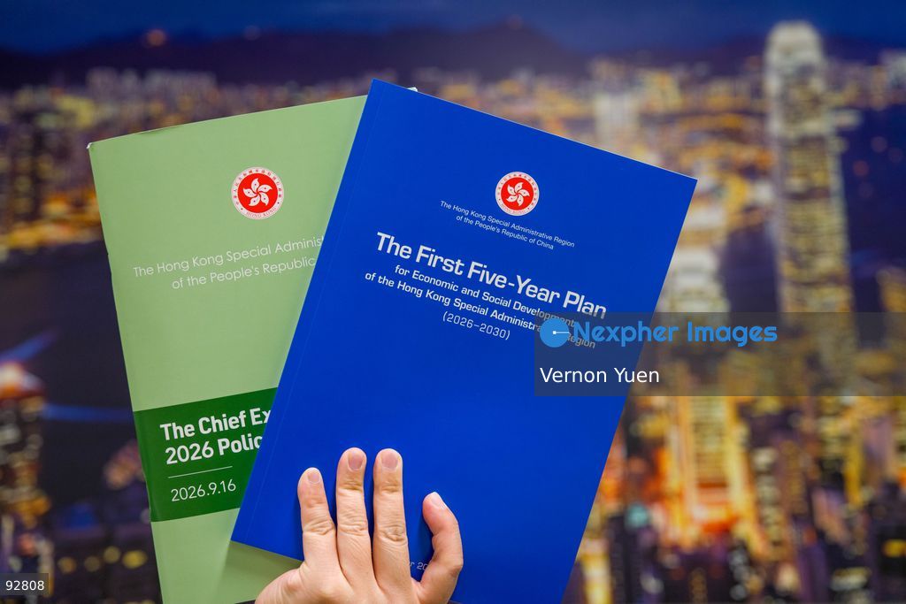The Hong Kong Chief Executive 2026 Policy Address and the Hong Kong First Five Year plan booklet in front of a photo of the Hong Kong Skyline on September 16, 2026 in Hong Kong. (Photo by Vernon Yuen/Nexpher Images Stock)