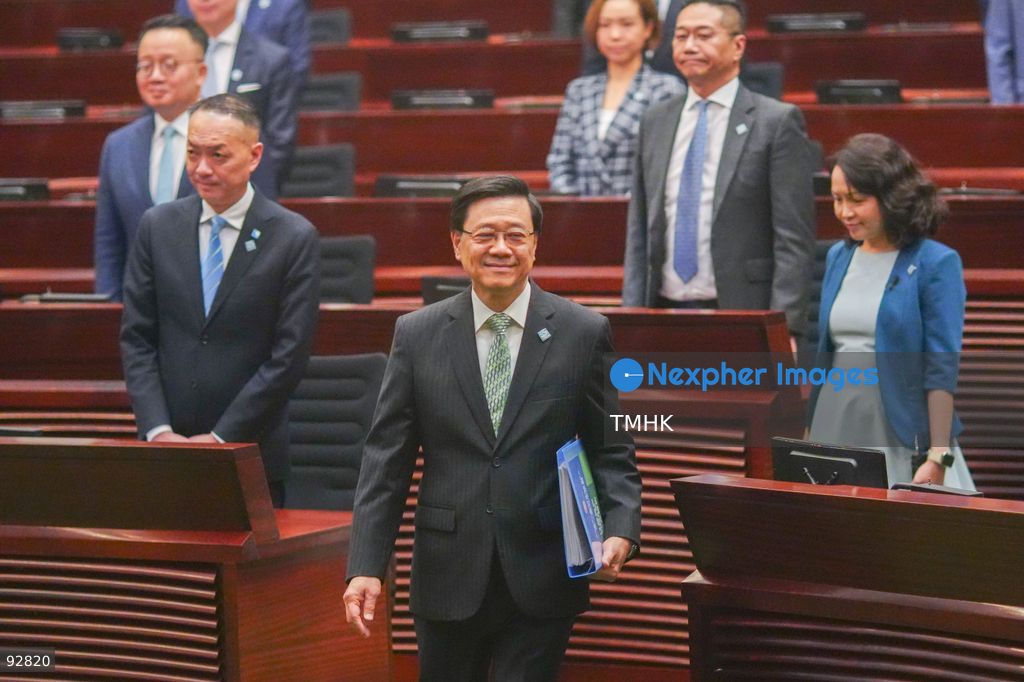 Lawmakers stand to welcome Hong Kong Chief Executive John Lee Ka-chiu as he enters the Legislative Council chamber to deliver his 2026 Policy Address on September 16, 2026 in Hong Kong. (Photo by Zulu Lo/TMHK via Nexpher Images)