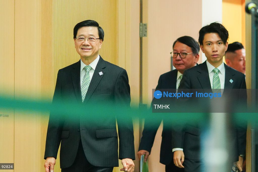 Hong Kong Chief Executive John Lee Ka-chiu, followed by Chief Secretary for Administration Chan Kwok-ki, arrives at a press conference on the 2026 Policy Address and the "First Five-Year Plan of Hong Kong" on September 16, 2026 in Hong Kong. (Photo by Zulu Lo/TMHK via Nexpher Images)