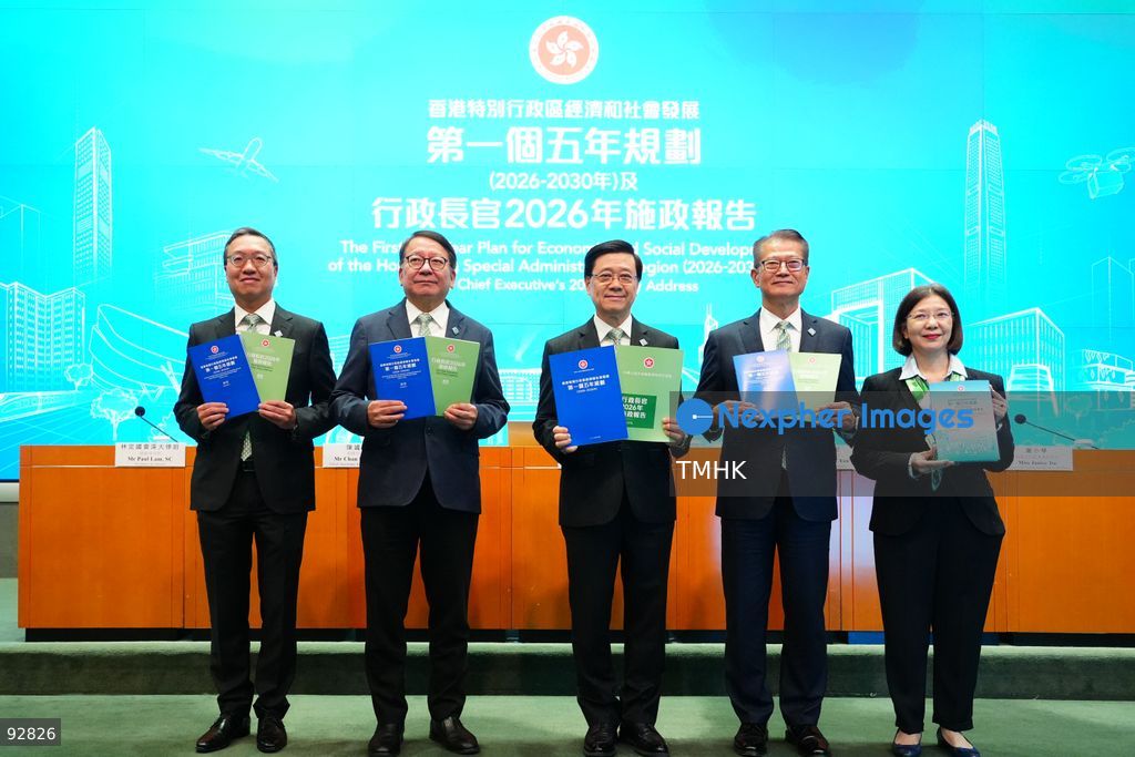 Hong Kong Chief Executive John Lee Ka-chiu; Chief Secretary for Administration Chan Kwok-ki; Financial Secretary Paul Chan Mo-po; Secretary for Justice Paul Lam Ting-kwok; and Secretary for Constitutional and Mainland Affairs Janice Tse Siu-wa pose for a photo call, holding copies of the 2026 Policy Address, the "First Five-Year Plan of Hong Kong," and highlight booklets, during a press conference on September 16, 2026 in Hong Kong. (Photo by Zulu Lo/TMHK via Nexpher Images)