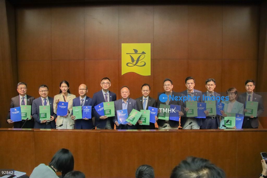 Lawmakers from the Legislative Council's "C15+" group hold up copies of the "First Five-Year Plan of Hong Kong" and the 2026 Policy Address for a photo call before a press conference on September 16, 2026 in Hong Kong. (Photo by Gordon Choi/TMHK via Nexpher Images)
