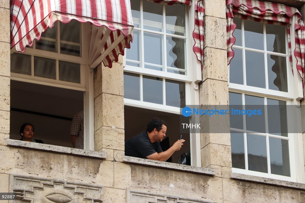 Spectators watch and photograph the Prinsjesdag royal procession from windows of a building in The Hague, Netherlands, September 15, 2026. (Photo by Liona Li/TMHK via Nexpher Images)