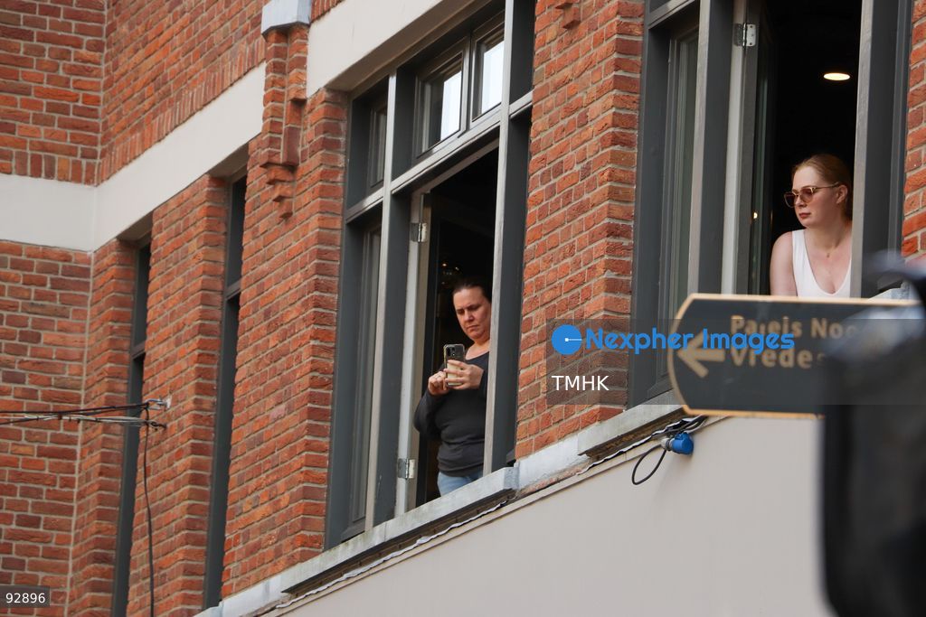 Spectators watch and photograph the Prinsjesdag royal procession from windows of a building in The Hague, Netherlands, September 15, 2026. (Photo by Liona Li/TMHK via Nexpher Images)