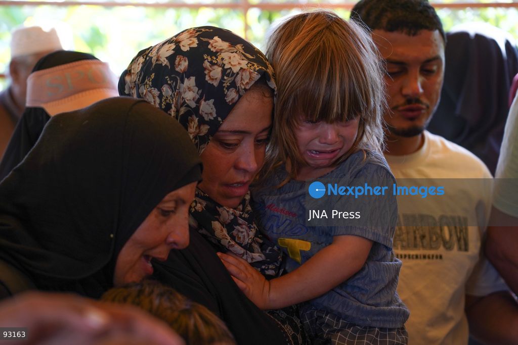 KHAN YOUNIS, GAZA STRIP, PALESTINE, SEPTEMBER 16, 2026: Relatives mourn and bid farewell to eight-year-old Amal Al-Mughayyir, who was reported killed in an Israeli strike the previous night in the Al-Mawasi area of Khan Younis, southern Gaza Strip. Photo by Ramzi Abu Amer / JNA Press. (Photo by Ramzi Abu Amer/JNA Press via Nexpher Images)