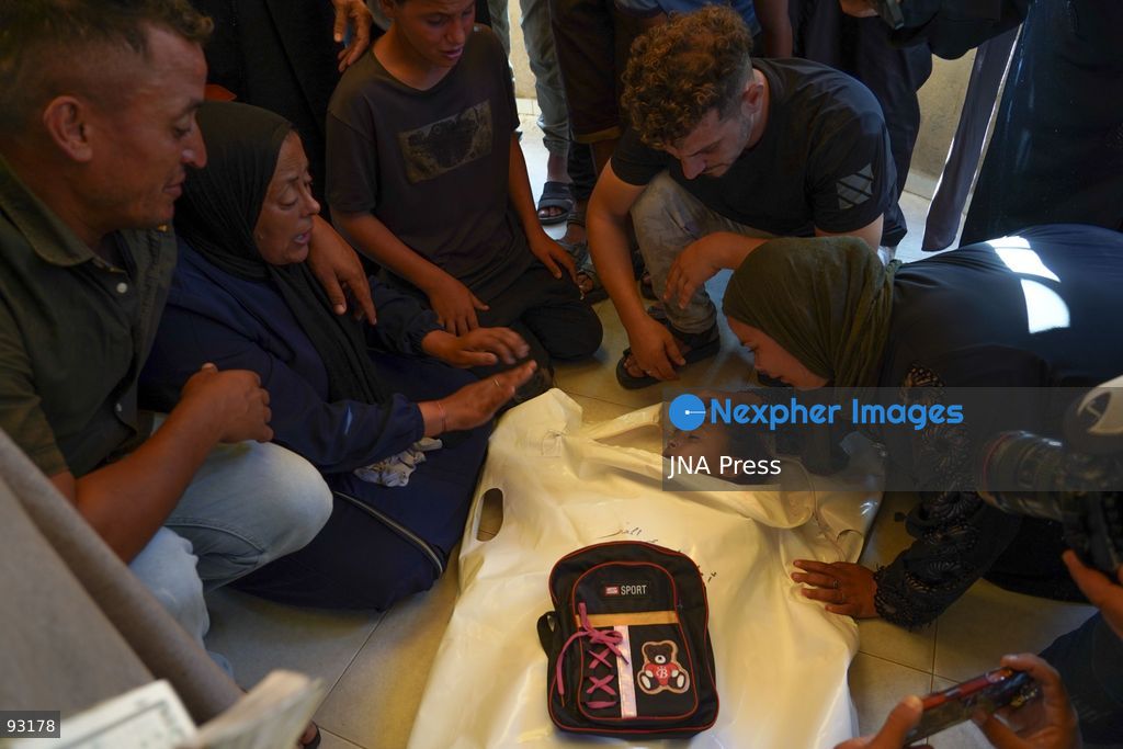 KHAN YOUNIS, GAZA STRIP, PALESTINE, SEPTEMBER 16, 2026: Relatives mourn and bid farewell to eight-year-old Amal Al-Mughayyir, who was reported killed in an Israeli strike the previous night in the Al-Mawasi area of Khan Younis, southern Gaza Strip. Photo by Ramzi Abu Amer / JNA Press. (Photo by Ramzi Abu Amer/JNA Press via Nexpher Images)