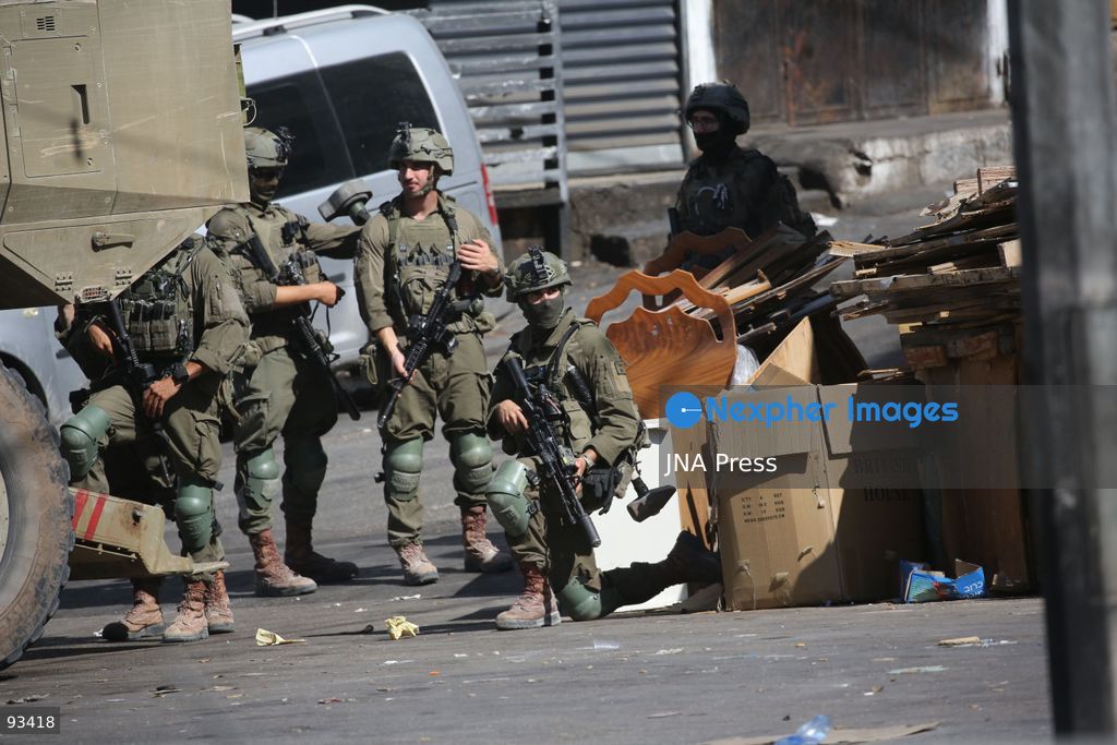 NABLUS, OCCUPIED WEST BANK, SEPTEMBER 17, 2026: Israeli troops move along a street during a military operation in Ein Beit al-Ma refugee camp, west of Nablus in the occupied West Bank. Photo by Nedal Shtieh / JNA Press. (Photo by Nedal Shtieh/JNA Press via Nexpher Images)