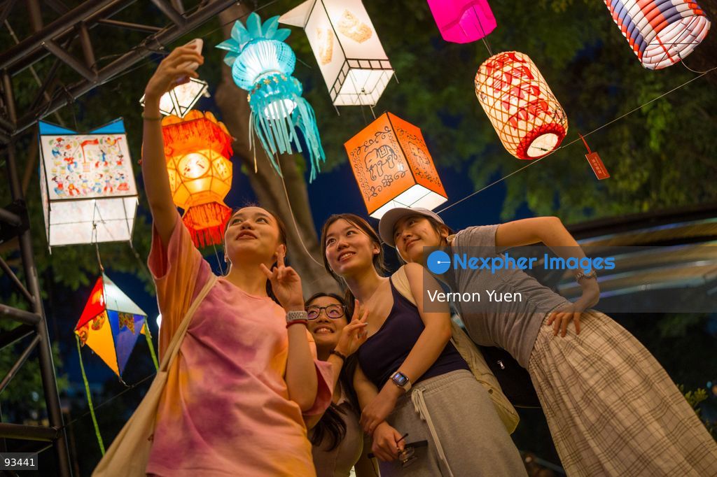 Visitors taking a selfie with the Mid Autumn Festival Lights at Victoria Park on September 17, 2026 in Hong Kong. (Photo by Vernon Yuen/Nexpher Images)