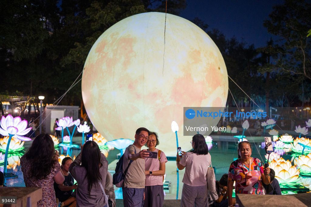 Visitors taking a selfie with the Mid Autumn Festival Lights at Victoria Park on September 17, 2026 in Hong Kong. (Photo by Vernon Yuen/Nexpher Images)