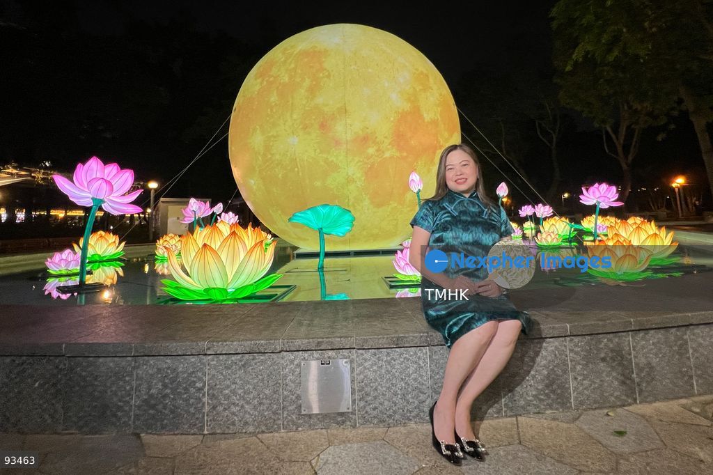 Secretary for Culture, Sports and Tourism Rosanna Law Shuk-pui poses with a festive lantern display during her visit to the "International Mid-Autumn Lantern Carnival" at Victoria Park on September 17, 2026 in Hong Kong. (Photo by Peter Tsang/TMHK via Nexpher Images)