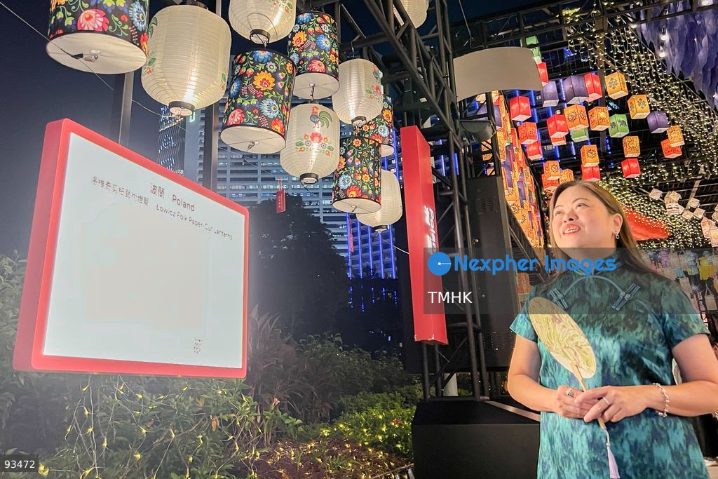 A close-up view shows Secretary for Culture, Sports and Tourism Rosanna Law Shuk-pui admiring lantern installations during her visit to the "International Mid-Autumn Lantern Carnival" at Victoria Park on September 17, 2026 in Hong Kong. (Photo by Peter Tsang/TMHK via Nexpher Images)