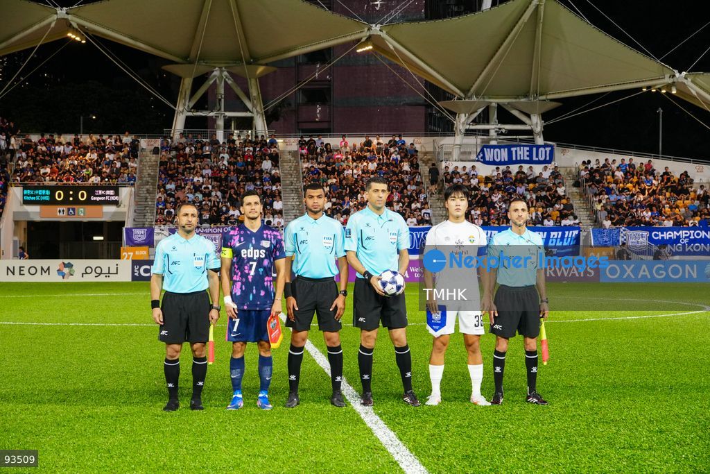 Captains of Kitchee and Gangwon FC pose with match officials for the coin toss prior to the AFC Champions League Two group stage match at Mong Kok Stadium on September 17, 2026 in Hong Kong. (Photo by Zulu Lo/TMHK via Nexpher Images)