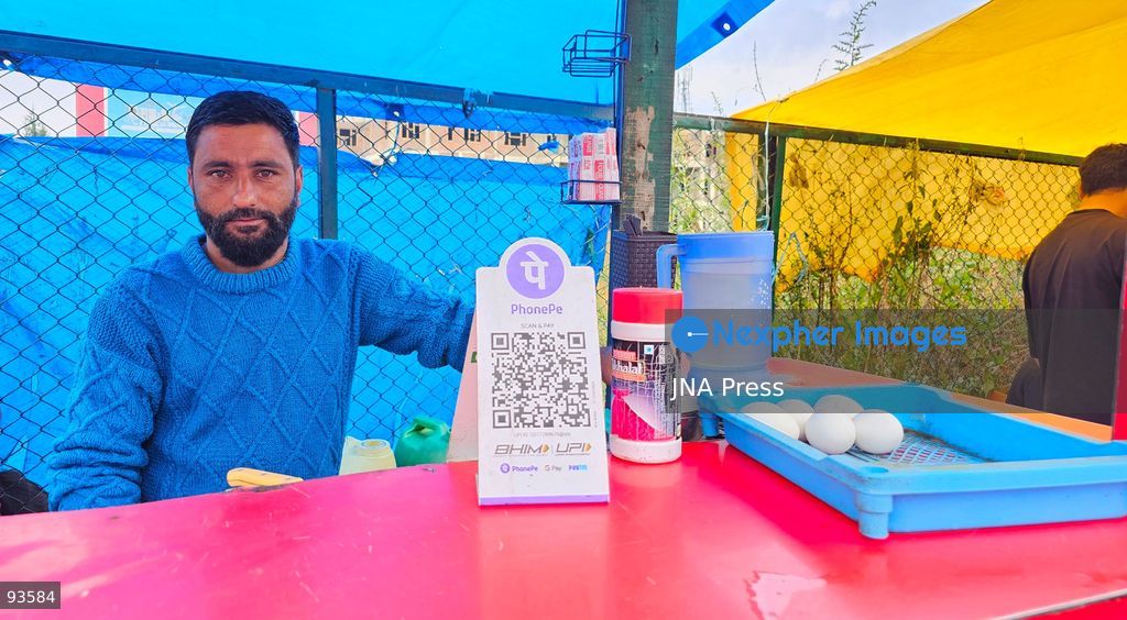 SRINAGAR, KASHMIR, INDIA, SEPTEMBER 16, 2026: A customer scans a Unified Payments Interface (UPI) QR code to make a digital payment using a smartphone at a shop in Srinagar. From October 15, India will introduce a 0.4% Merchant Discount Rate (MDR) on certain person-to-merchant UPI transactions above ₹2,000, while consumers will not be directly charged. Photo by Umer Qadir / JNA Press. (Photo by Umer Qadir/JNA Press via Nexpher Images)