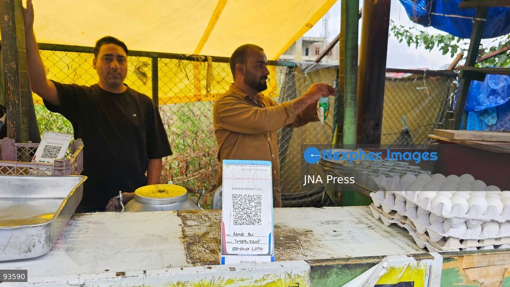 SRINAGAR, KASHMIR, INDIA, SEPTEMBER 16, 2026: A customer scans a Unified Payments Interface (UPI) QR code to make a digital payment using a smartphone at a shop in Srinagar. From October 15, India will introduce a 0.4% Merchant Discount Rate (MDR) on certain person-to-merchant UPI transactions above ₹2,000, while consumers will not be directly charged. Photo by Umer Qadir / JNA Press. (Photo by Umer Qadir/JNA Press via Nexpher Images)