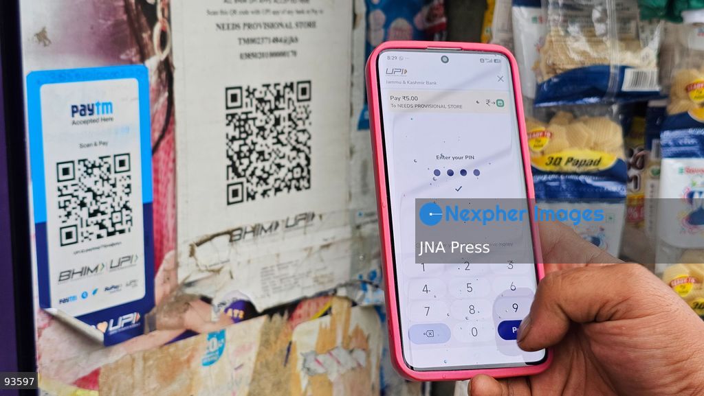 SRINAGAR, KASHMIR, INDIA, SEPTEMBER 16, 2026: A customer scans a Unified Payments Interface (UPI) QR code to make a digital payment using a smartphone at a shop in Srinagar. From October 15, India will introduce a 0.4% Merchant Discount Rate (MDR) on certain person-to-merchant UPI transactions above ₹2,000, while consumers will not be directly charged. Photo by Umer Qadir / JNA Press. (Photo by Umer Qadir/JNA Press via Nexpher Images)