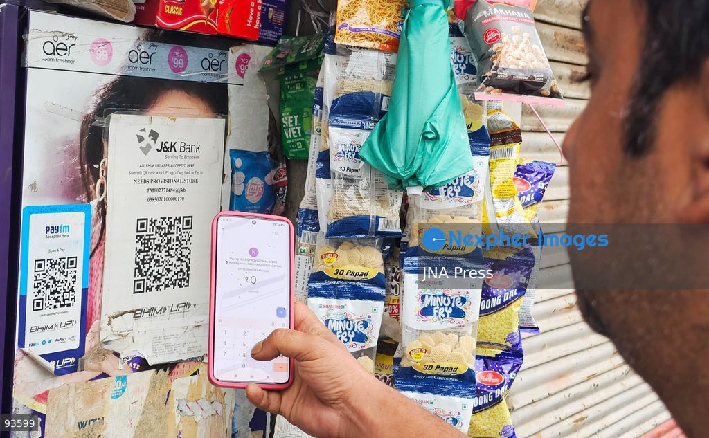 SRINAGAR, KASHMIR, INDIA, SEPTEMBER 16, 2026: A customer scans a Unified Payments Interface (UPI) QR code to make a digital payment using a smartphone at a shop in Srinagar. From October 15, India will introduce a 0.4% Merchant Discount Rate (MDR) on certain person-to-merchant UPI transactions above ₹2,000, while consumers will not be directly charged. Photo by Umer Qadir / JNA Press. (Photo by Umer Qadir/JNA Press via Nexpher Images)