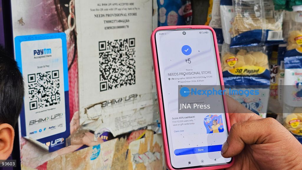 SRINAGAR, KASHMIR, INDIA, SEPTEMBER 16, 2026: A customer scans a Unified Payments Interface (UPI) QR code to make a digital payment using a smartphone at a shop in Srinagar. From October 15, India will introduce a 0.4% Merchant Discount Rate (MDR) on certain person-to-merchant UPI transactions above ₹2,000, while consumers will not be directly charged. Photo by Umer Qadir / JNA Press. (Photo by Umer Qadir/JNA Press via Nexpher Images)