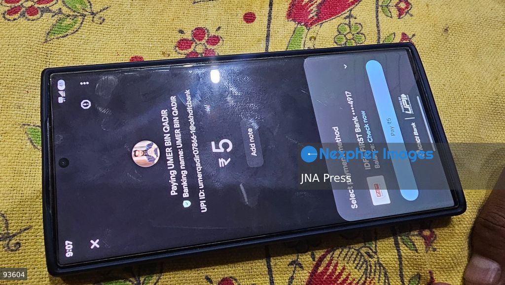 SRINAGAR, KASHMIR, INDIA, SEPTEMBER 16, 2026: A customer scans a Unified Payments Interface (UPI) QR code to make a digital payment using a smartphone at a shop in Srinagar. From October 15, India will introduce a 0.4% Merchant Discount Rate (MDR) on certain person-to-merchant UPI transactions above ₹2,000, while consumers will not be directly charged. Photo by Umer Qadir / JNA Press. (Photo by Umer Qadir/JNA Press via Nexpher Images)