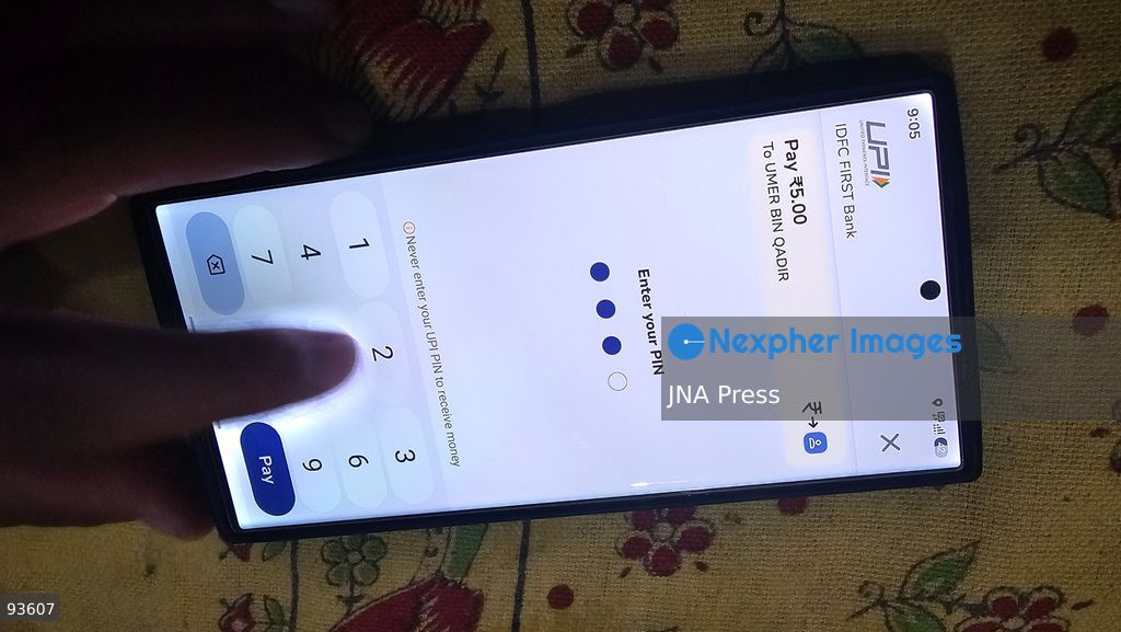 SRINAGAR, KASHMIR, INDIA, SEPTEMBER 16, 2026: A customer scans a Unified Payments Interface (UPI) QR code to make a digital payment using a smartphone at a shop in Srinagar. From October 15, India will introduce a 0.4% Merchant Discount Rate (MDR) on certain person-to-merchant UPI transactions above ₹2,000, while consumers will not be directly charged. Photo by Umer Qadir / JNA Press. (Photo by Umer Qadir/JNA Press via Nexpher Images)