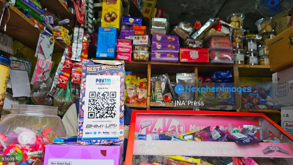 SRINAGAR, KASHMIR, INDIA, SEPTEMBER 16, 2026: A customer scans a Unified Payments Interface (UPI) QR code to make a digital payment using a smartphone at a shop in Srinagar. From October 15, India will introduce a 0.4% Merchant Discount Rate (MDR) on certain person-to-merchant UPI transactions above ₹2,000, while consumers will not be directly charged. Photo by Umer Qadir / JNA Press. (Photo by Umer Qadir/JNA Press via Nexpher Images)