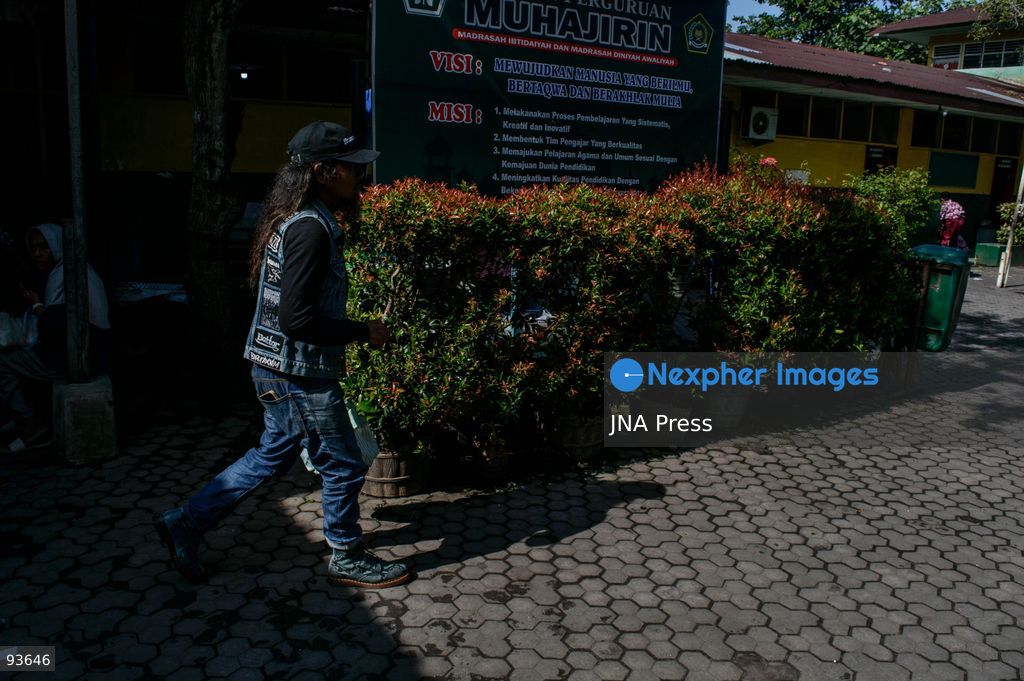 MEDAN, NORTH SUMATRA, INDONESIA, SEPTEMBER 17, 2026: The reflection of musician Jovan Siahaan, 42, appears on a smartphone displaying the Suno AI music platform as he arranges compositions for his digital solo project, Agent AI, in Medan, North Sumatra. Siahaan, who works as the project’s arranger and vocalist, uses artificial intelligence tools during the production process before adding his own vocal recordings to songs addressing social issues. The project is scheduled to perform at the Medanfor Thepunx #6 event. Photo by Sutanta Aditya / JNA Press. (Photo by Sutanta Aditya/JNA Press via Nexpher Images)