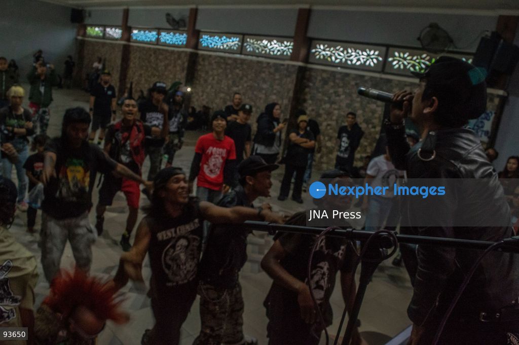 MEDAN, NORTH SUMATRA, INDONESIA, SEPTEMBER 17, 2026: The reflection of musician Jovan Siahaan, 42, appears on a smartphone displaying the Suno AI music platform as he arranges compositions for his digital solo project, Agent AI, in Medan, North Sumatra. Siahaan, who works as the project’s arranger and vocalist, uses artificial intelligence tools during the production process before adding his own vocal recordings to songs addressing social issues. The project is scheduled to perform at the Medanfor Thepunx #6 event. Photo by Sutanta Aditya / JNA Press. (Photo by Sutanta Aditya/JNA Press via Nexpher Images)