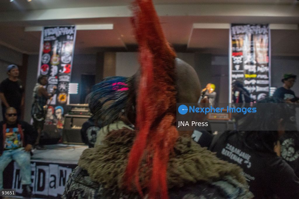 MEDAN, NORTH SUMATRA, INDONESIA, SEPTEMBER 17, 2026: The reflection of musician Jovan Siahaan, 42, appears on a smartphone displaying the Suno AI music platform as he arranges compositions for his digital solo project, Agent AI, in Medan, North Sumatra. Siahaan, who works as the project’s arranger and vocalist, uses artificial intelligence tools during the production process before adding his own vocal recordings to songs addressing social issues. The project is scheduled to perform at the Medanfor Thepunx #6 event. Photo by Sutanta Aditya / JNA Press. (Photo by Sutanta Aditya/JNA Press via Nexpher Images)