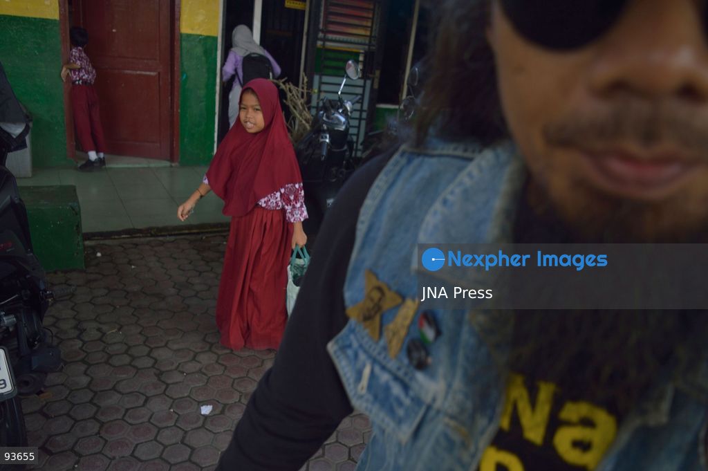 MEDAN, NORTH SUMATRA, INDONESIA, SEPTEMBER 17, 2026: The reflection of musician Jovan Siahaan, 42, appears on a smartphone displaying the Suno AI music platform as he arranges compositions for his digital solo project, Agent AI, in Medan, North Sumatra. Siahaan, who works as the project’s arranger and vocalist, uses artificial intelligence tools during the production process before adding his own vocal recordings to songs addressing social issues. The project is scheduled to perform at the Medanfor Thepunx #6 event. Photo by Sutanta Aditya / JNA Press. (Photo by Sutanta Aditya/JNA Press via Nexpher Images)