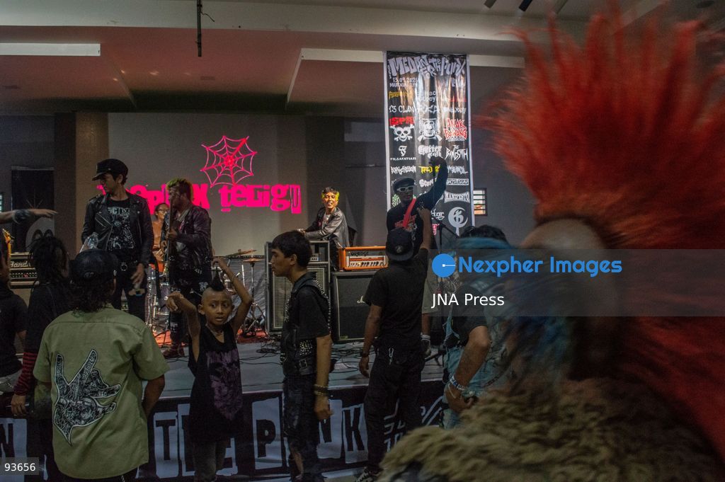 MEDAN, NORTH SUMATRA, INDONESIA, SEPTEMBER 17, 2026: The reflection of musician Jovan Siahaan, 42, appears on a smartphone displaying the Suno AI music platform as he arranges compositions for his digital solo project, Agent AI, in Medan, North Sumatra. Siahaan, who works as the project’s arranger and vocalist, uses artificial intelligence tools during the production process before adding his own vocal recordings to songs addressing social issues. The project is scheduled to perform at the Medanfor Thepunx #6 event. Photo by Sutanta Aditya / JNA Press. (Photo by Sutanta Aditya/JNA Press via Nexpher Images)