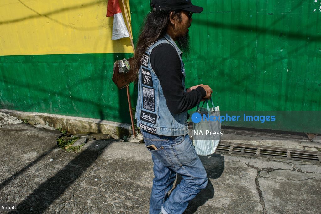 MEDAN, NORTH SUMATRA, INDONESIA, SEPTEMBER 17, 2026: The reflection of musician Jovan Siahaan, 42, appears on a smartphone displaying the Suno AI music platform as he arranges compositions for his digital solo project, Agent AI, in Medan, North Sumatra. Siahaan, who works as the project’s arranger and vocalist, uses artificial intelligence tools during the production process before adding his own vocal recordings to songs addressing social issues. The project is scheduled to perform at the Medanfor Thepunx #6 event. Photo by Sutanta Aditya / JNA Press. (Photo by Sutanta Aditya/JNA Press via Nexpher Images)