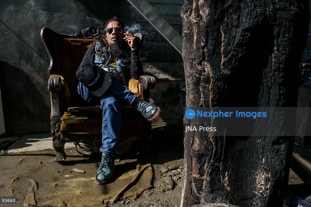 MEDAN, NORTH SUMATRA, INDONESIA, SEPTEMBER 17, 2026: The reflection of musician Jovan Siahaan, 42, appears on a smartphone displaying the Suno AI music platform as he arranges compositions for his digital solo project, Agent AI, in Medan, North Sumatra. Siahaan, who works as the project’s arranger and vocalist, uses artificial intelligence tools during the production process before adding his own vocal recordings to songs addressing social issues. The project is scheduled to perform at the Medanfor Thepunx #6 event. Photo by Sutanta Aditya / JNA Press. (Photo by Sutanta Aditya/JNA Press via Nexpher Images)