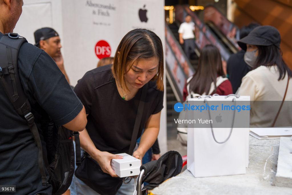 An iphone reseller outside an apple store on the first day on sale of the iphone 18 pro on September 18, 2026 in Hong Kong. (Photo by Vernon Yuen/Nexpher Images)