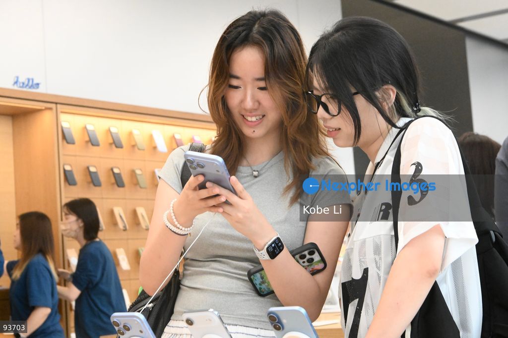 Ladies playing Iphone 18 Pro at an apple store on the first day on sale of the iphone 18 pro on September 18, 2026 in Hong Kong. (Photo by Kobe Li/Nexpher Images)