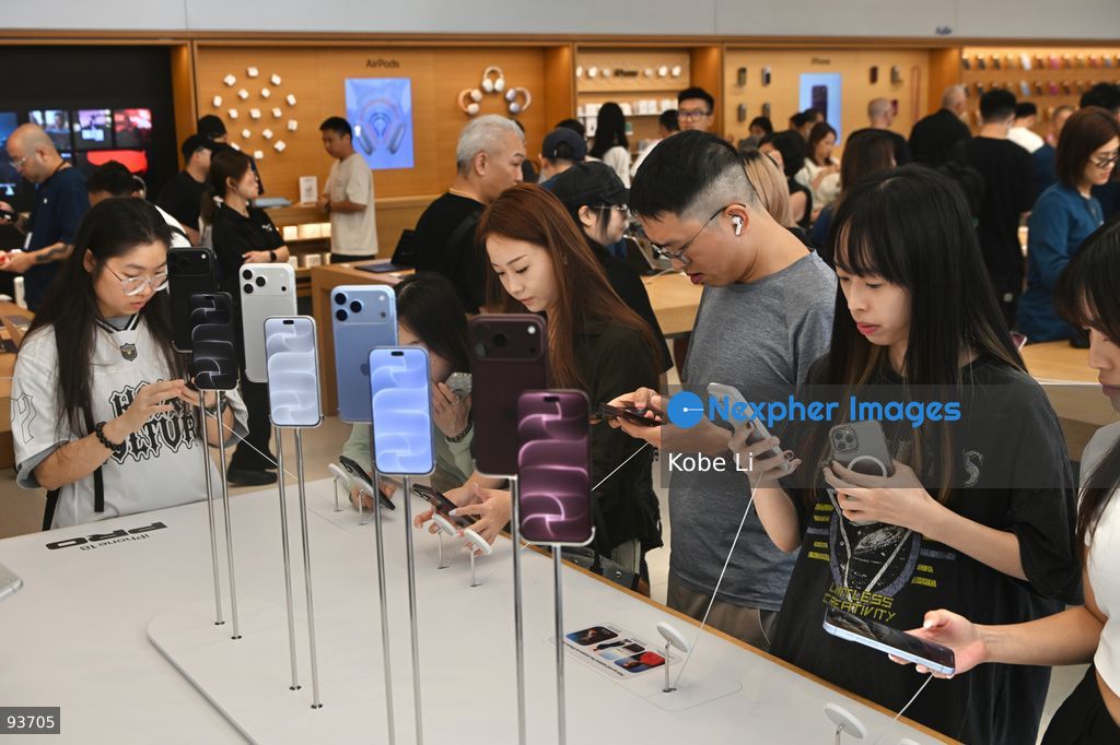 People playing Iphone 18 Pro at an apple store on the first day on sale of the iphone 18 pro on September 18, 2026 in Hong Kong. (Photo by Kobe Li/Nexpher Images)