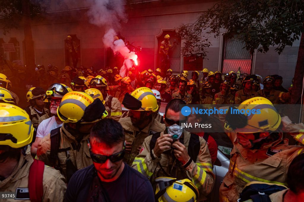 BARCELONA, SPAIN, SEPTEMBER 18, 2026: Firefighters from the Generalitat de Catalunya demonstrate outside the regional Interior Department in Barcelona during a protest demanding better pay, improved protective equipment and increased staffing and resources. Around 800 firefighters took part in the march from Plaça de Sant Jaume, according to Barcelona’s municipal police. Protesters used pyrotechnics and smoke flares as the demonstration intensified outside the Interior Department. Photo by Marc Asensio Clupés / JNA Press. (Photo by Marc Asensio Clupes/JNA Press via Nexpher Images)