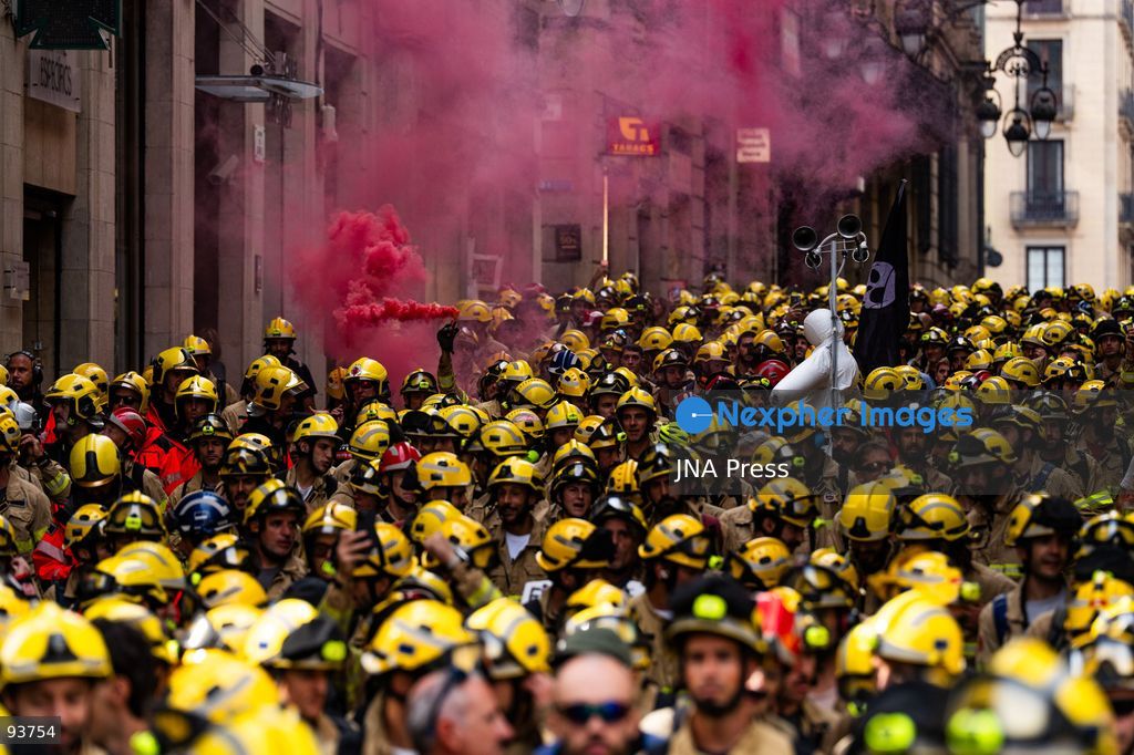 BARCELONA, SPAIN, SEPTEMBER 18, 2026: Firefighters from the Generalitat de Catalunya demonstrate outside the regional Interior Department in Barcelona during a protest demanding better pay, improved protective equipment and increased staffing and resources. Around 800 firefighters took part in the march from Plaça de Sant Jaume, according to Barcelona’s municipal police. Protesters used pyrotechnics and smoke flares as the demonstration intensified outside the Interior Department. Photo by Marc Asensio Clupés / JNA Press. (Photo by Marc Asensio Clupes/JNA Press via Nexpher Images)