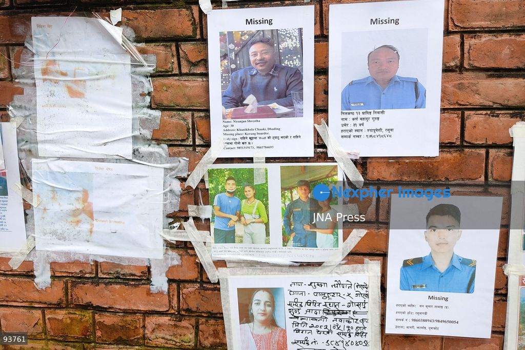 KATHMANDU, NEPAL, SEPTEMBER 18, 2026: Bodies of approximately 50 unidentified victims of the August 26 flash floods are transported for temporary burial at Gokarneshwor in Kathmandu as authorities continue efforts to identify those recovered from the disaster. Relatives wait at the morgue of Tribhuvan University Teaching Hospital, where photographs of people reported missing are displayed to assist families searching for loved ones. Authorities are collecting DNA samples and maintaining records of unidentified remains to allow future identification and return to relatives. The floods that struck the Bhote Koshi and Trishuli river systems have killed at least 1,410 people, with thousands still reported missing. Photo by Safal Prakash Shrestha / JNA Press. (Photo by Safal Prakash Shrestha/JNA Press via Nexpher Images)