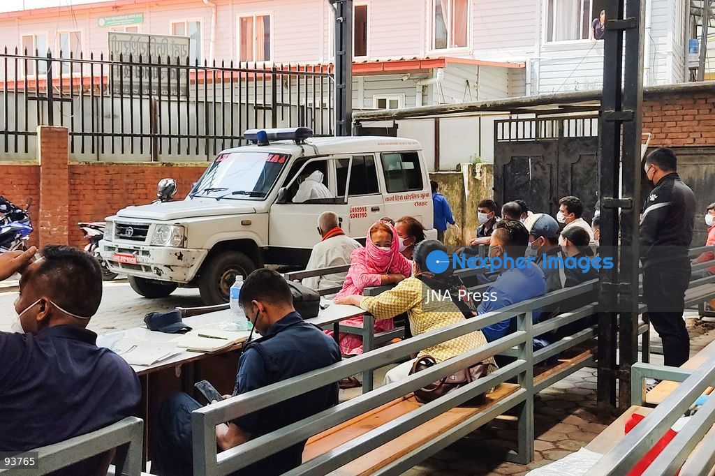 KATHMANDU, NEPAL, SEPTEMBER 18, 2026: Bodies of approximately 50 unidentified victims of the August 26 flash floods are transported for temporary burial at Gokarneshwor in Kathmandu as authorities continue efforts to identify those recovered from the disaster. Relatives wait at the morgue of Tribhuvan University Teaching Hospital, where photographs of people reported missing are displayed to assist families searching for loved ones. Authorities are collecting DNA samples and maintaining records of unidentified remains to allow future identification and return to relatives. The floods that struck the Bhote Koshi and Trishuli river systems have killed at least 1,410 people, with thousands still reported missing. Photo by Safal Prakash Shrestha / JNA Press. (Photo by Safal Prakash Shrestha/JNA Press via Nexpher Images)
