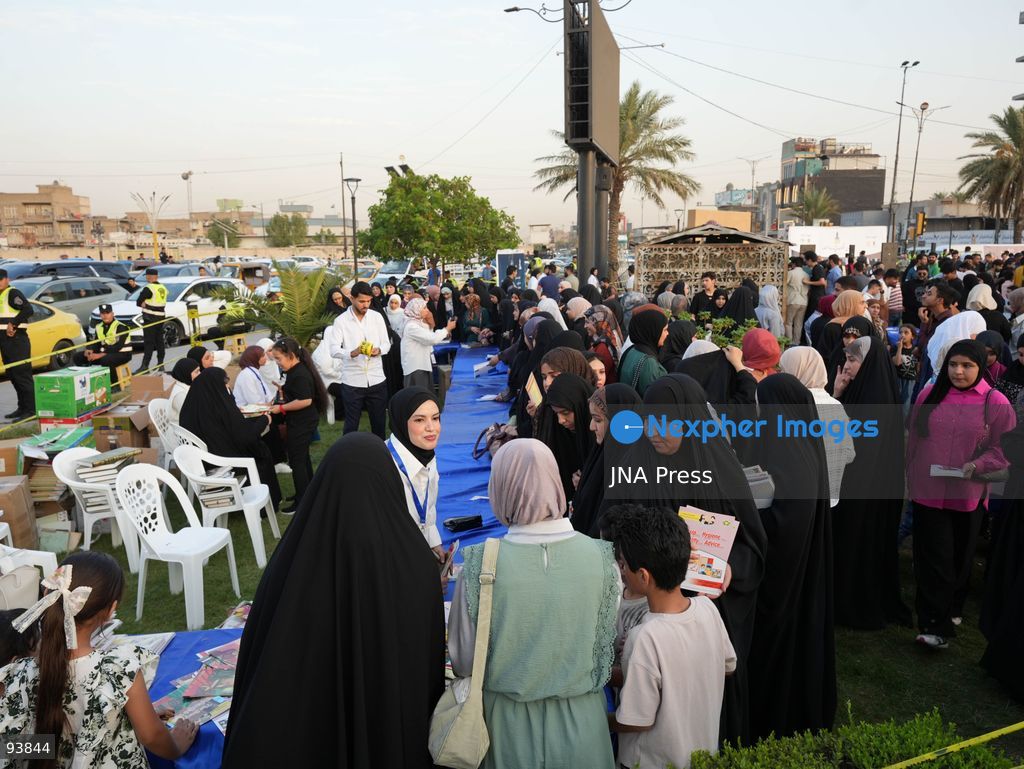 BAGHDAD, IRAQ, SEPTEMBER 18, 2026: Visitors attend the third edition of the Book Festival at Muzaffar Square in Sadr City, eastern Baghdad. Organizers distributed 12,000 books free of charge during the event, which aims to encourage reading and make books more accessible to the local community. Photo by Muntazer Sahip/ JNA Press. (Photo by Muntazer Uday Sahib/JNA Press via Nexpher Images)