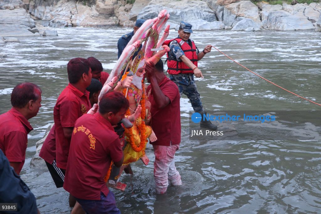 KATHMANDU, NEPAL, SEPTEMBER 18, 2026: Hindu devotees carry and immerse idols of Lord Vishwakarma in the Bagmati River at Chobhar in Kathmandu, marking the conclusion of annual Vishwakarma Puja celebrations. Worshippers perform traditional rituals, offer prayers and smear colored powder on one another before lowering clay idols into the river. Vishwakarma Puja is observed by artisans, mechanics and industrial workers, who traditionally worship their tools, machinery and vehicles in honor of the Hindu deity associated with architecture and craftsmanship. Photo by Shankar Bhujel / JNA Press. (Photo by Shankar Bhujel/JNA Press via Nexpher Images)