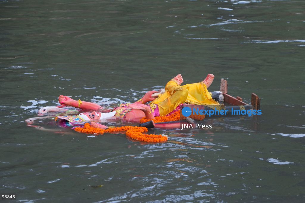 KATHMANDU, NEPAL, SEPTEMBER 18, 2026: Hindu devotees carry and immerse idols of Lord Vishwakarma in the Bagmati River at Chobhar in Kathmandu, marking the conclusion of annual Vishwakarma Puja celebrations. Worshippers perform traditional rituals, offer prayers and smear colored powder on one another before lowering clay idols into the river. Vishwakarma Puja is observed by artisans, mechanics and industrial workers, who traditionally worship their tools, machinery and vehicles in honor of the Hindu deity associated with architecture and craftsmanship. Photo by Shankar Bhujel / JNA Press. (Photo by Shankar Bhujel/JNA Press via Nexpher Images)
