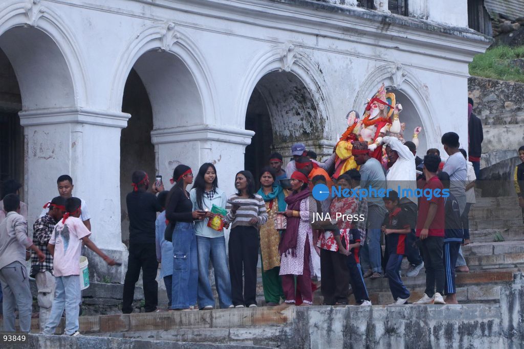 KATHMANDU, NEPAL, SEPTEMBER 18, 2026: Hindu devotees carry and immerse idols of Lord Vishwakarma in the Bagmati River at Chobhar in Kathmandu, marking the conclusion of annual Vishwakarma Puja celebrations. Worshippers perform traditional rituals, offer prayers and smear colored powder on one another before lowering clay idols into the river. Vishwakarma Puja is observed by artisans, mechanics and industrial workers, who traditionally worship their tools, machinery and vehicles in honor of the Hindu deity associated with architecture and craftsmanship. Photo by Shankar Bhujel / JNA Press. (Photo by Shankar Bhujel/JNA Press via Nexpher Images)