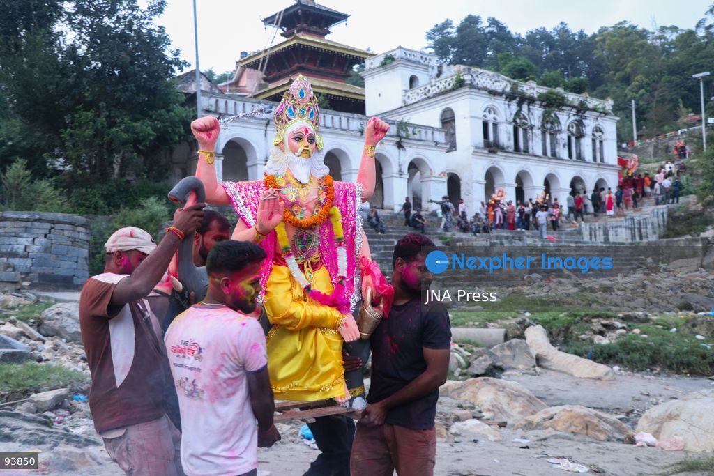 KATHMANDU, NEPAL, SEPTEMBER 18, 2026: Hindu devotees carry and immerse idols of Lord Vishwakarma in the Bagmati River at Chobhar in Kathmandu, marking the conclusion of annual Vishwakarma Puja celebrations. Worshippers perform traditional rituals, offer prayers and smear colored powder on one another before lowering clay idols into the river. Vishwakarma Puja is observed by artisans, mechanics and industrial workers, who traditionally worship their tools, machinery and vehicles in honor of the Hindu deity associated with architecture and craftsmanship. Photo by Shankar Bhujel / JNA Press. (Photo by Shankar Bhujel/JNA Press via Nexpher Images)