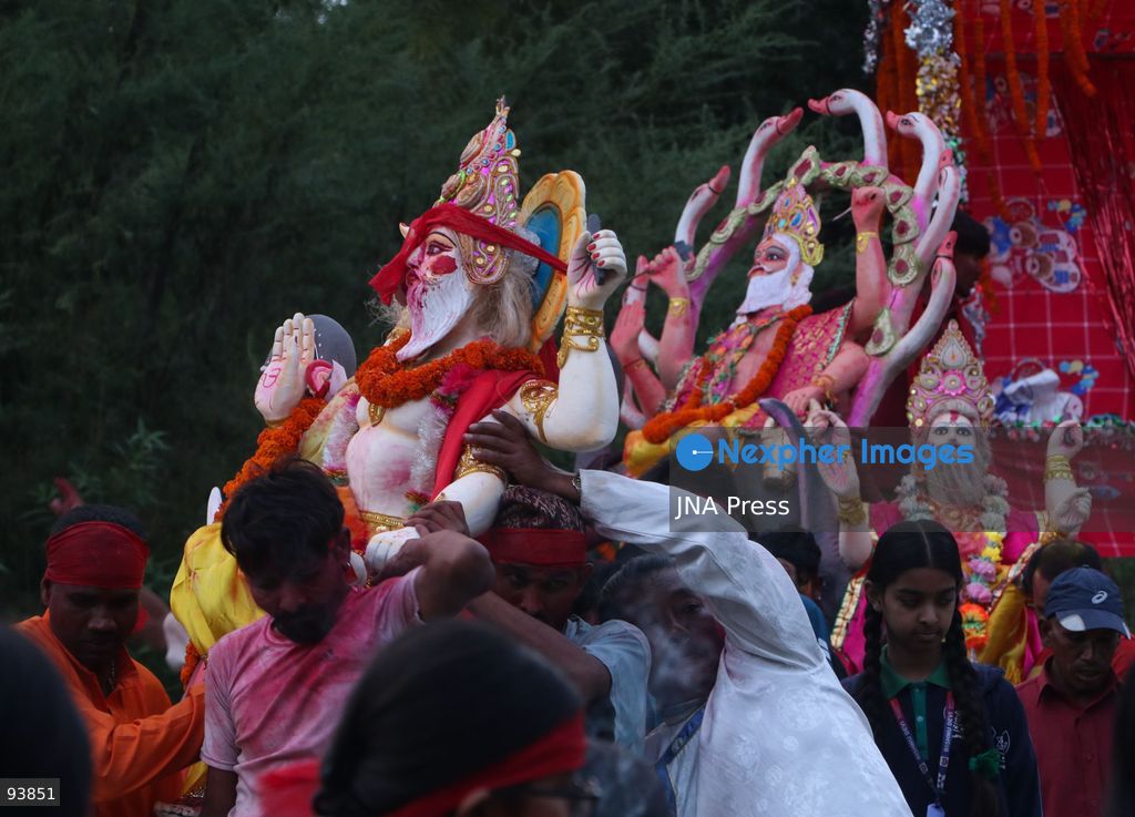 KATHMANDU, NEPAL, SEPTEMBER 18, 2026: Hindu devotees carry and immerse idols of Lord Vishwakarma in the Bagmati River at Chobhar in Kathmandu, marking the conclusion of annual Vishwakarma Puja celebrations. Worshippers perform traditional rituals, offer prayers and smear colored powder on one another before lowering clay idols into the river. Vishwakarma Puja is observed by artisans, mechanics and industrial workers, who traditionally worship their tools, machinery and vehicles in honor of the Hindu deity associated with architecture and craftsmanship. Photo by Shankar Bhujel / JNA Press. (Photo by Shankar Bhujel/JNA Press via Nexpher Images)