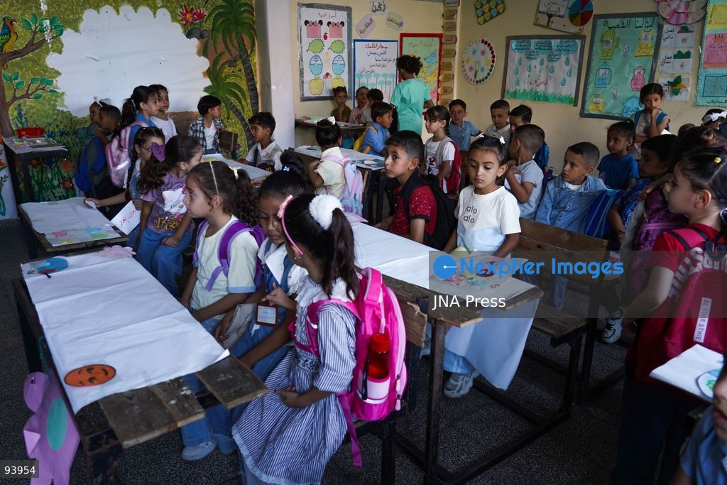NUSEIRAT, GAZA STRIP, SEPTEMBER 19, 2026: Palestinian children return to classrooms at an UNRWA school in Nuseirat refugee camp in the central Gaza Strip as in-person education gradually resumes following years of disruption caused by the war. The return comes as the new academic year begins in Gaza, where widespread destruction, displacement and the use of school buildings as shelters have severely disrupted access to education. Photo by Ramzi Abu Amer / JNA Press. (Photo by Ramzi Abu Amer/JNA Press via Nexpher Images)
