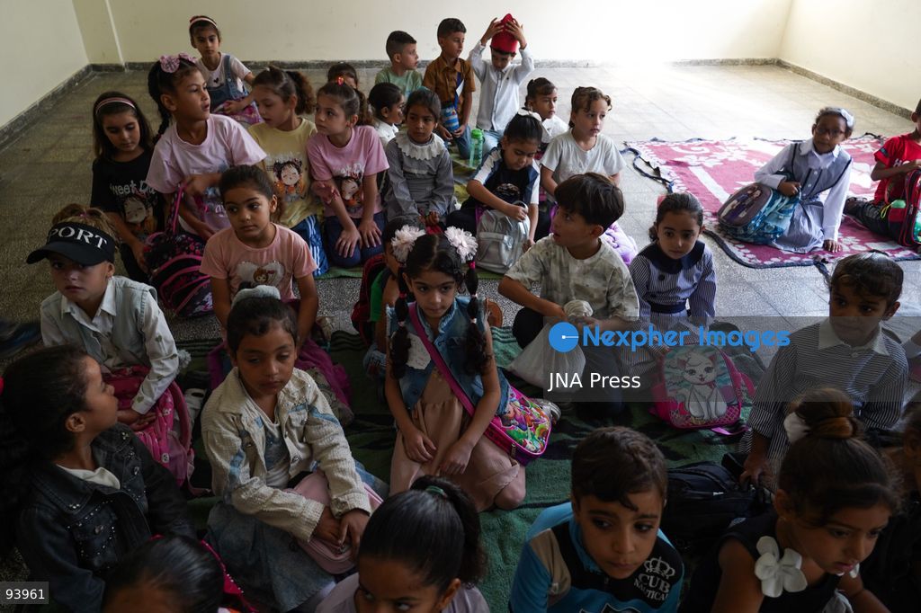 NUSEIRAT, GAZA STRIP, SEPTEMBER 19, 2026: Palestinian children return to classrooms at an UNRWA school in Nuseirat refugee camp in the central Gaza Strip as in-person education gradually resumes following years of disruption caused by the war. The return comes as the new academic year begins in Gaza, where widespread destruction, displacement and the use of school buildings as shelters have severely disrupted access to education. Photo by Ramzi Abu Amer / JNA Press. (Photo by Ramzi Abu Amer/JNA Press via Nexpher Images)