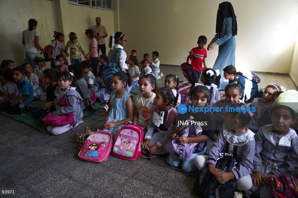 NUSEIRAT, GAZA STRIP, SEPTEMBER 19, 2026: Palestinian children return to classrooms at an UNRWA school in Nuseirat refugee camp in the central Gaza Strip as in-person education gradually resumes following years of disruption caused by the war. The return comes as the new academic year begins in Gaza, where widespread destruction, displacement and the use of school buildings as shelters have severely disrupted access to education. Photo by Ramzi Abu Amer / JNA Press. (Photo by Ramzi Abu Amer/JNA Press via Nexpher Images)