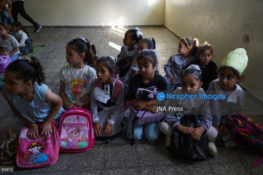 NUSEIRAT, GAZA STRIP, SEPTEMBER 19, 2026: Palestinian children return to classrooms at an UNRWA school in Nuseirat refugee camp in the central Gaza Strip as in-person education gradually resumes following years of disruption caused by the war. The return comes as the new academic year begins in Gaza, where widespread destruction, displacement and the use of school buildings as shelters have severely disrupted access to education. Photo by Ramzi Abu Amer / JNA Press. (Photo by Ramzi Abu Amer/JNA Press via Nexpher Images)