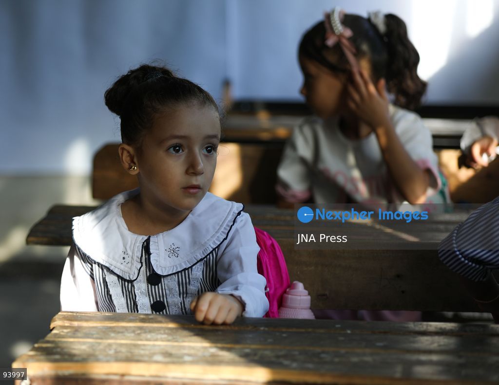 NUSEIRAT, GAZA STRIP, SEPTEMBER 19, 2026: Palestinian children return to classrooms at an UNRWA school in Nuseirat refugee camp in the central Gaza Strip as in-person education gradually resumes following years of disruption caused by the war. The return comes as the new academic year begins in Gaza, where widespread destruction, displacement and the use of school buildings as shelters have severely disrupted access to education. Photo by Ramzi Abu Amer / JNA Press. (Photo by Ramzi Abu Amer/JNA Press via Nexpher Images)